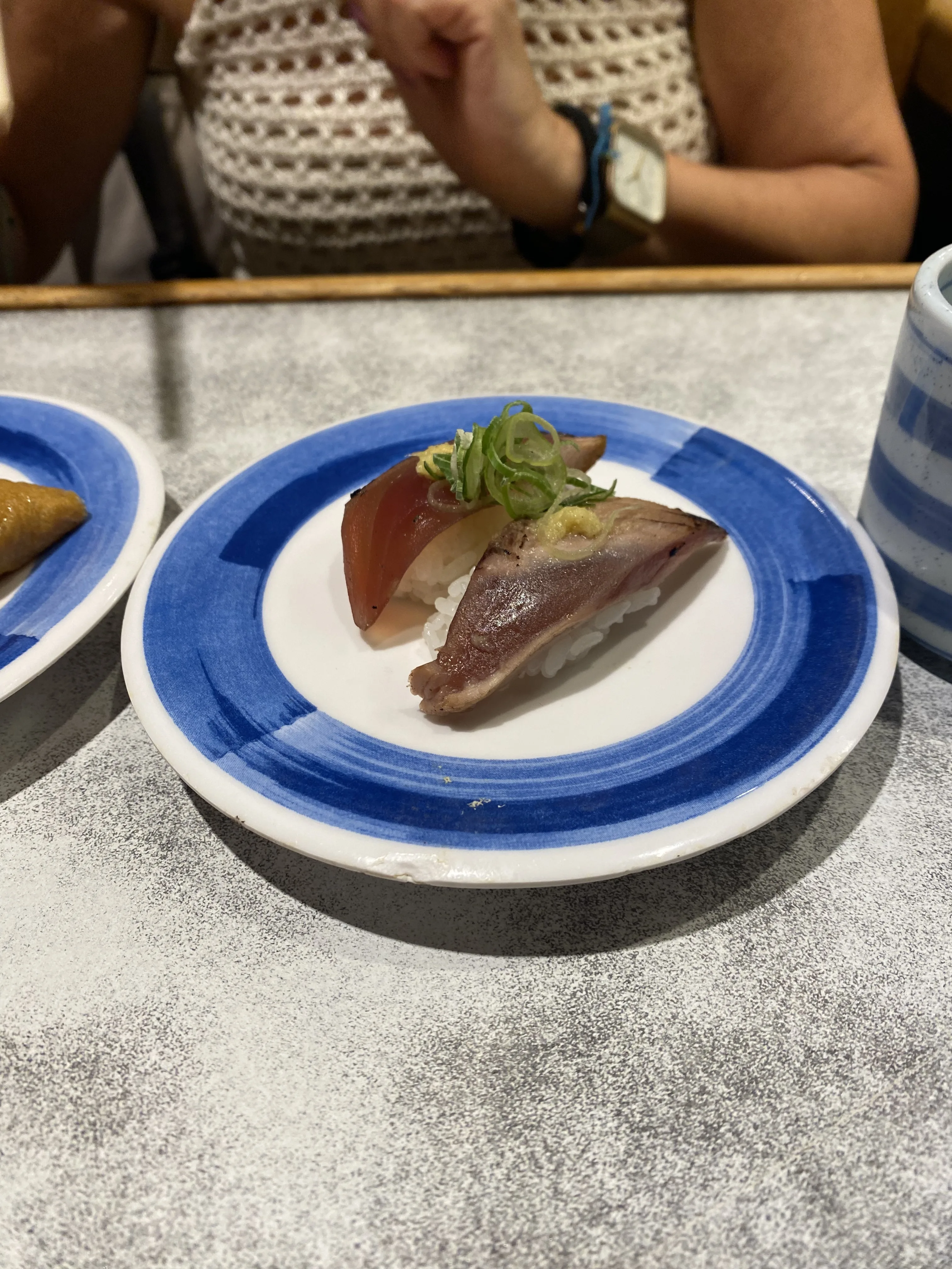Nigiri Seared Bonito with grated giger, green onion Nigiri Seared Bonito with grated giger, green onion